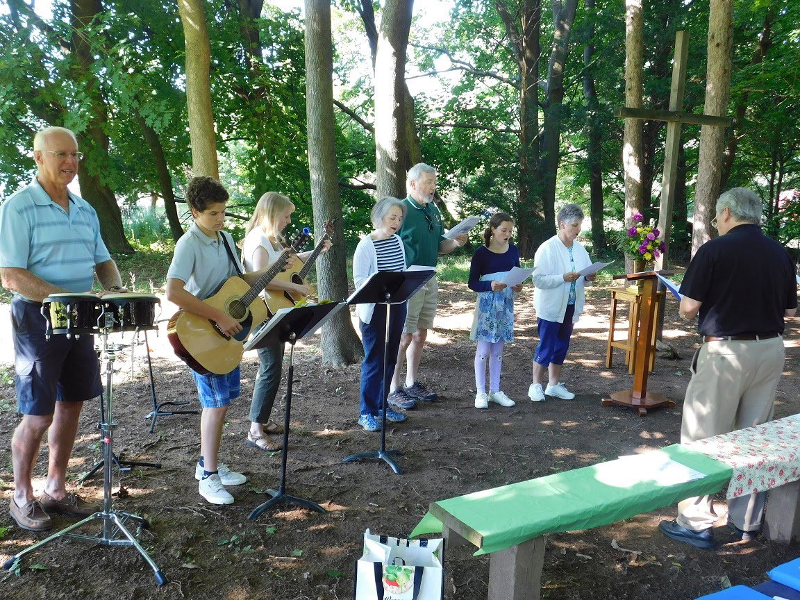 Congregation singing together during Sunday worship