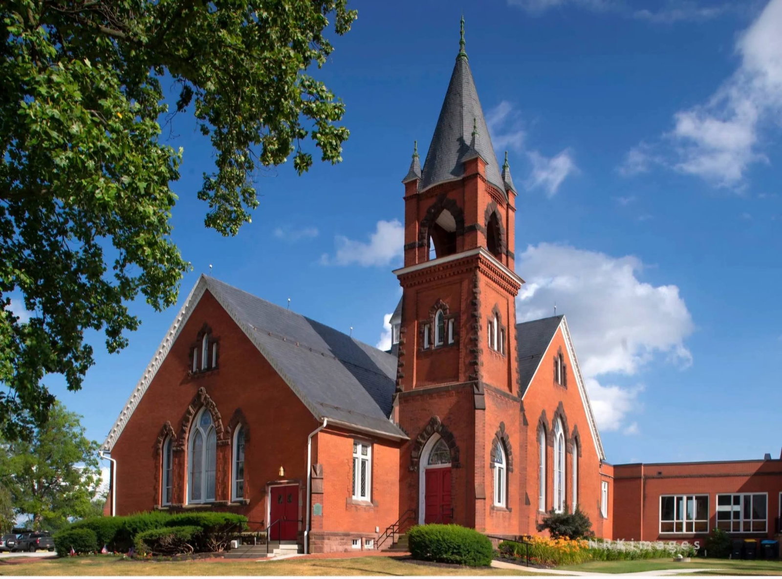 Steeple of Stewartstown Presbyterian Church framed by trees